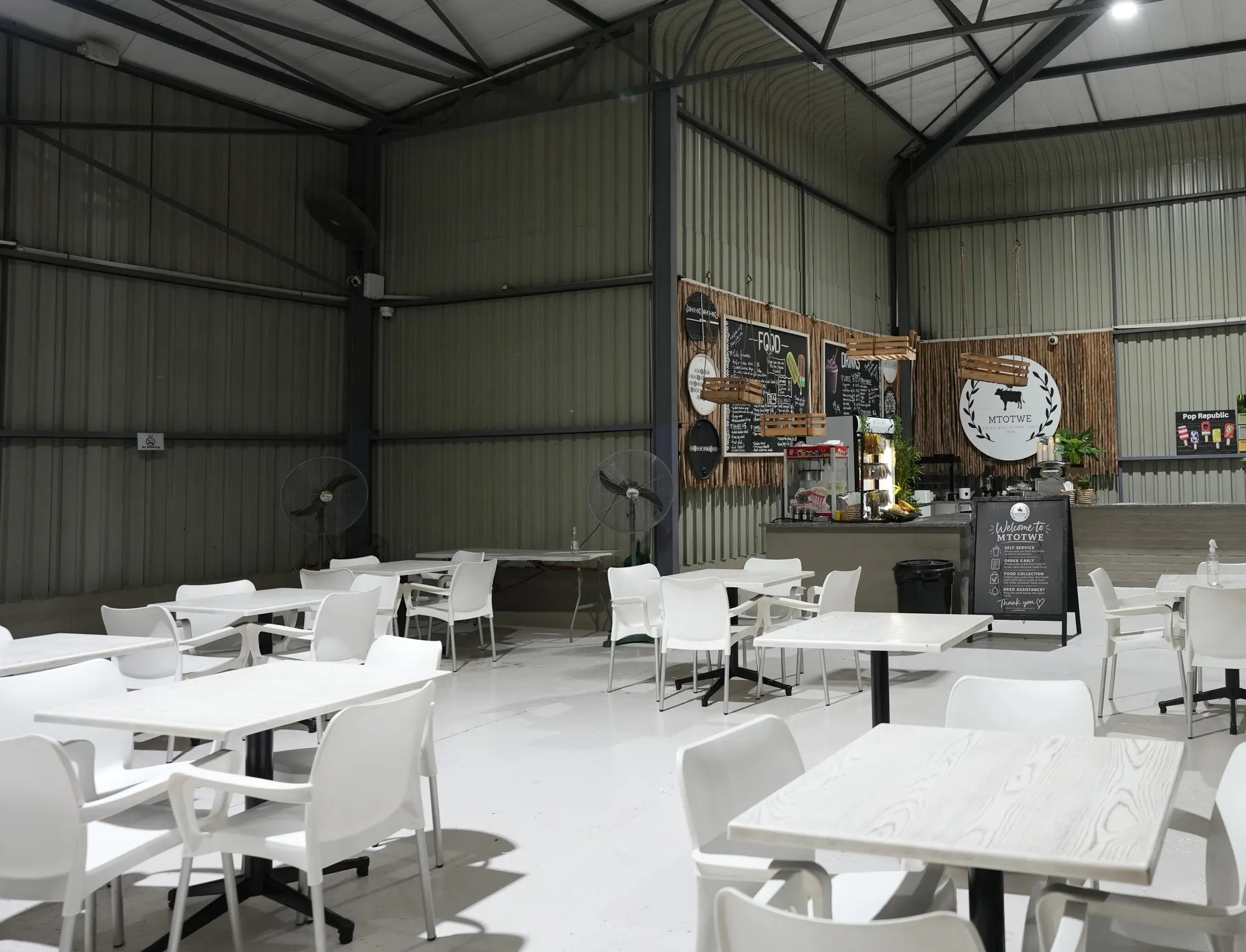 Tables and chairs set out in the café at Jump Trampoline Park, Harare
