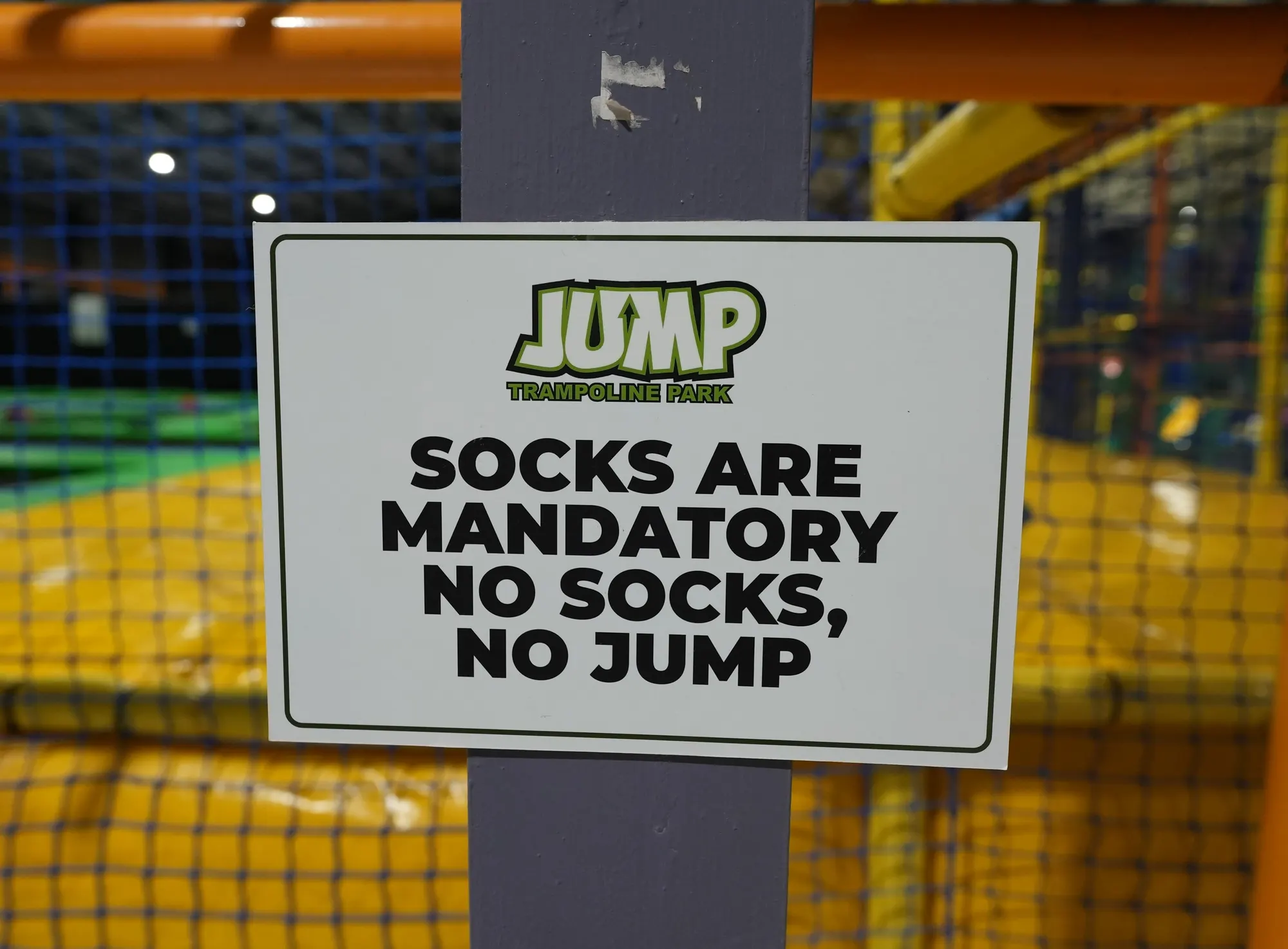A Jump sign that reads socks are mandatory, no socks, no jump